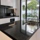 Đá granite đen kim sa làm mặt bếp hiện đại